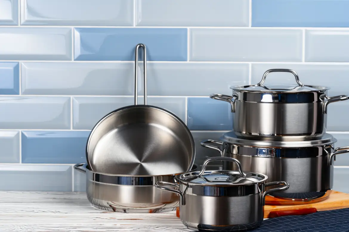Set of aluminum cookware on kitchen counter