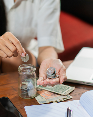 Young woman checking bills, taxes, bank account balance and calculating credit card expenses