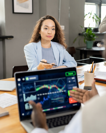 Confident businesswoman interacting with colleague